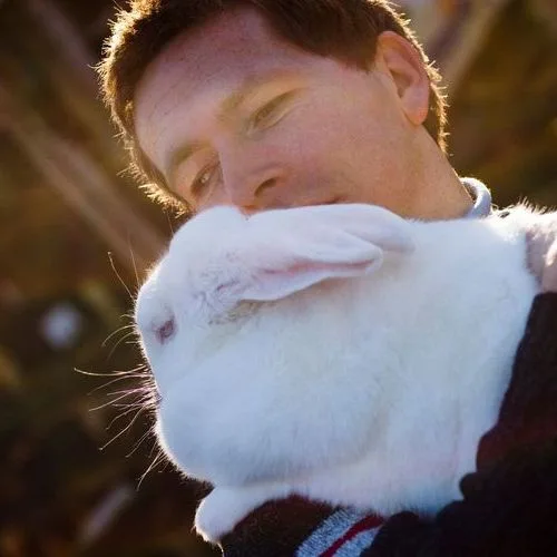 A man holding a rabbit