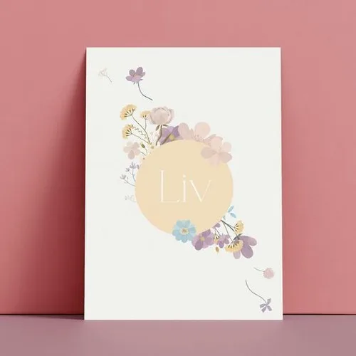 A white rectangular sign with flowers on it